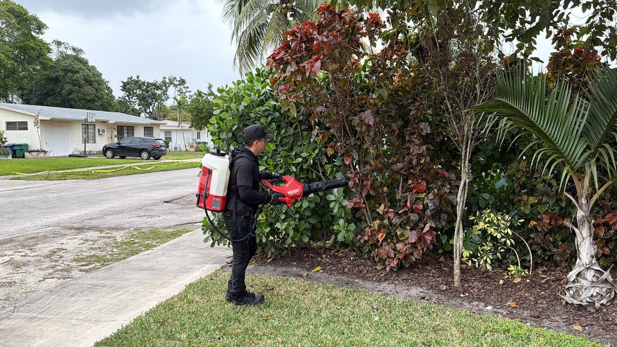 Technician installing In2Care station in South Florida landscaping